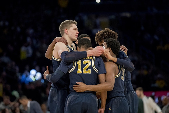 Moritz Wagner (13), Muhammad-Ali Abdur-Rahkman (12), Charles Matthews (1), Isaiah Livers (4), and Zavier Simpson (3)