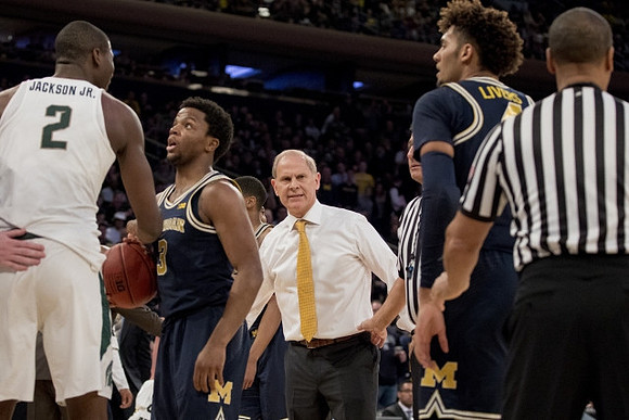 Zavier Simpson (3), John Beilein, and Isaiah Livers (4)