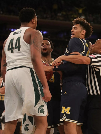 Zavier Simpson (3) and Isaiah Livers (4)