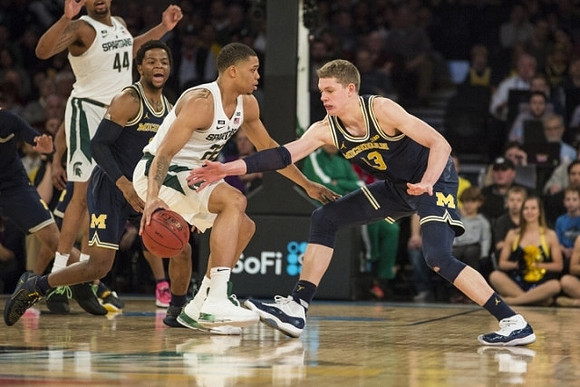 Zavier Simpson (3) and Moritz Wagner (13)