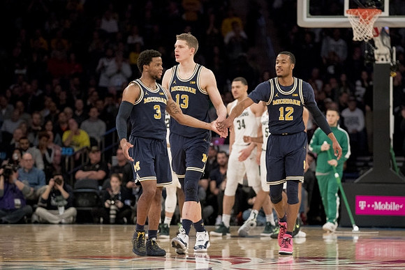 Zavier Simpson (3), Moritz Wagner (13), and Muhammad-Ali Abdur-Rahkman (12)