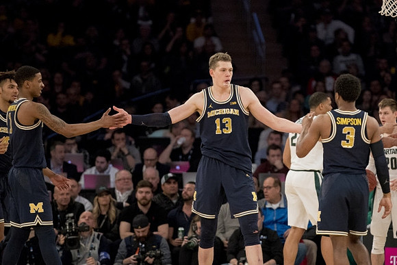 Isaiah Livers (4), Charles Matthews (1), Moritz Wagner (13), and Zavier Simpson (3)