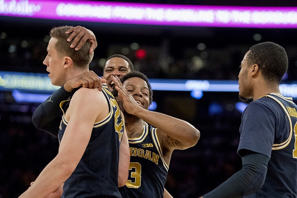 Duncan Robinson (22), Charles Matthews (1), Zavier Simpson (3), and Muhammad-Ali Abdur-Rahkman (12)