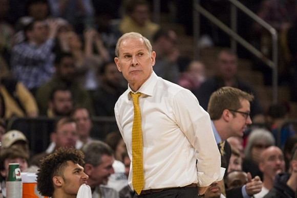 Isaiah Livers (4) and John Beilein
