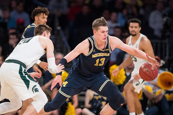 Isaiah Livers (4) and Moritz Wagner (13)