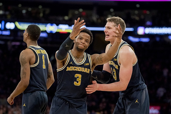 Charles Matthews (1), Zavier Simpson (3), and Moritz Wagner (13)