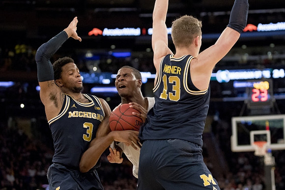 Zavier Simpson (3) and Moritz Wagner (13)