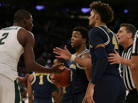 Charles Matthews (1), Zavier Simpson (3), and Isaiah Livers (4)