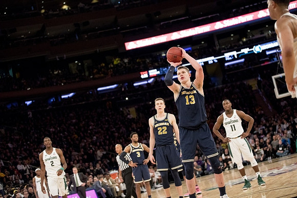 Zavier Simpson (3), Duncan Robinson (22), and Moritz Wagner (13)