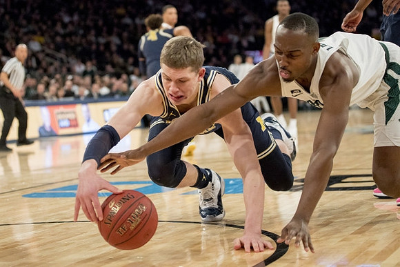 Moritz Wagner (13) and Isaiah Livers (4)