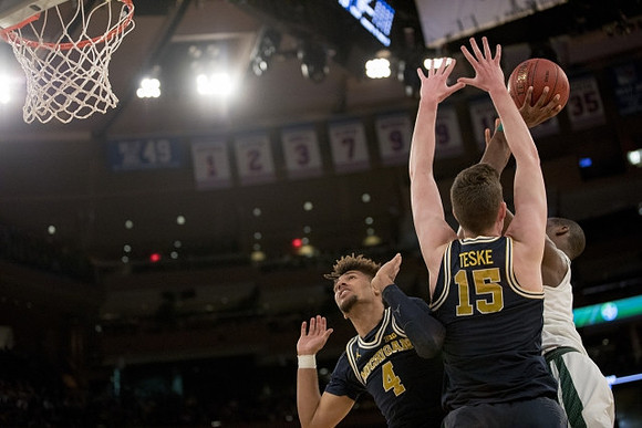 Isaiah Livers (4) and Jon Teske (15)
