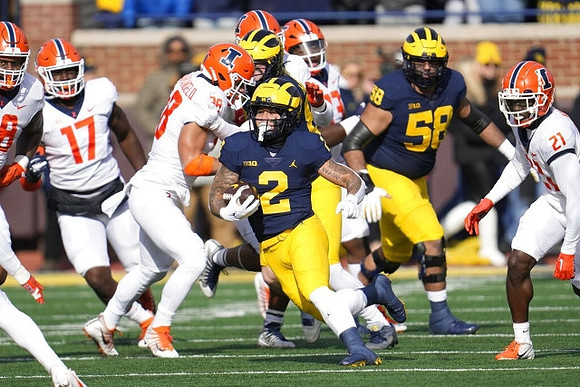 Blake Corum (2) and Giovanni El-Hadi (58)