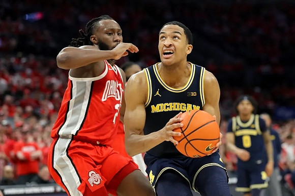Nimari Burnett (4) and Dug McDaniel (0)