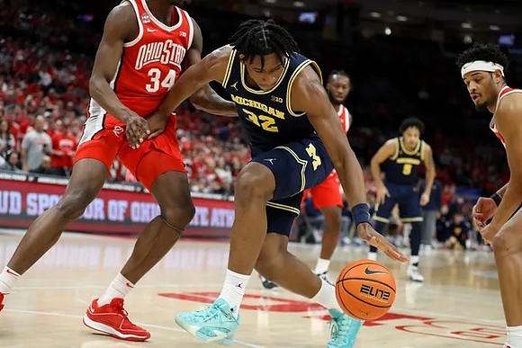 Tarris Reed Jr. (32) and Terrance Williams II (5)