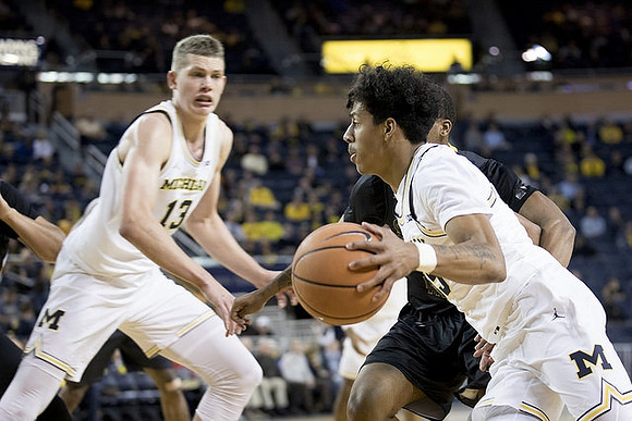 Moritz Wagner (13) and Eli Brooks (55)