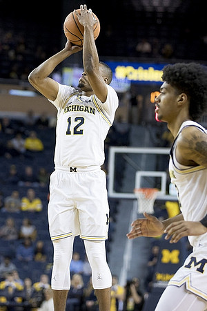 Muhammad-Ali Abdur-Rahkman (12) and Ibi Watson (23)
