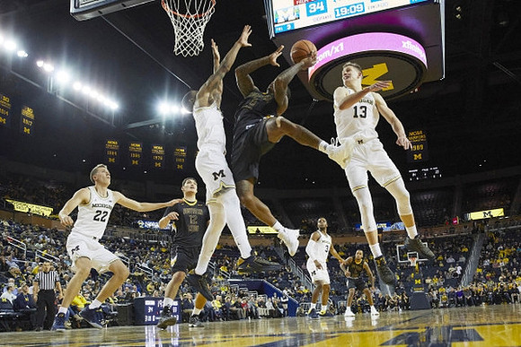 Duncan Robinson (22), Charles Matthews (1), Moritz Wagner (13), and Zavier Simpson (3)
