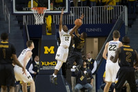 Jon Teske (15), Muhammad-Ali Abdur-Rahkman (12), and Duncan Robinson (22)