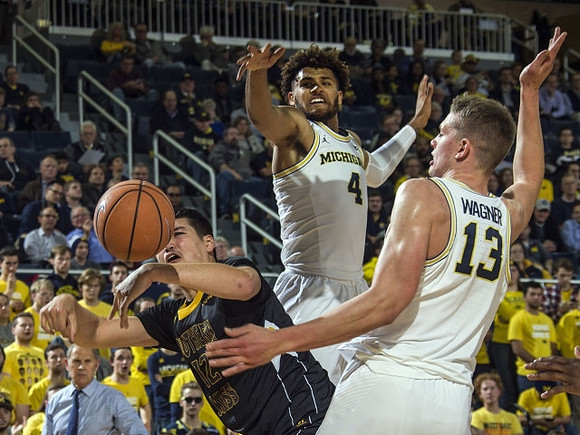 John Beilein, Isaiah Livers (4), and Moritz Wagner (13)