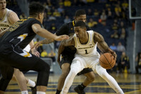 Jon Teske (15) and Charles Matthews (1)