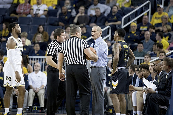 Zavier Simpson (3) and John Beilein