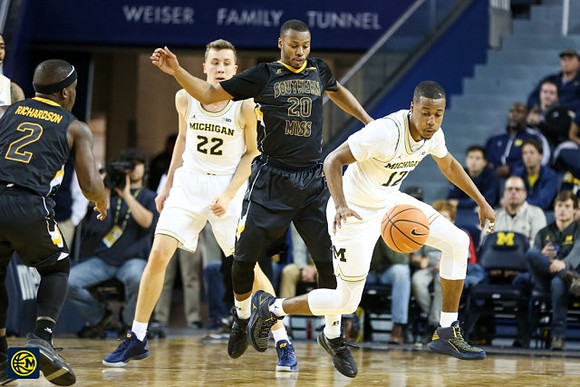 Duncan Robinson (22) and Muhammad-Ali Abdur-Rahkman (12)