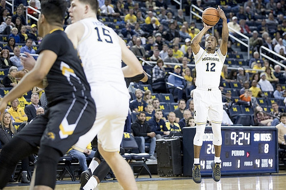 Jon Teske (15) and Muhammad-Ali Abdur-Rahkman (12)