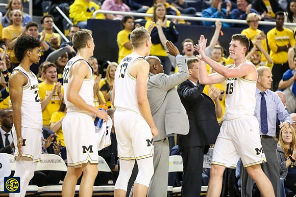 Jon Teske (15) and Michigan Team