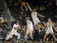 Eli Brooks (55), Moritz Wagner (13), Zavier Simpson (3), and Duncan Robinson (22)