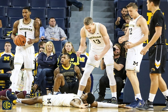 Charles Matthews (1), Moritz Wagner (13), Duncan Robinson (22), and Zavier Simpson (3)