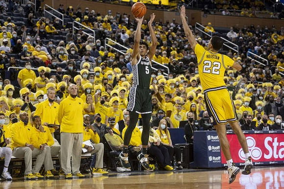 Caleb Houstan (22) and Phil Martelli
