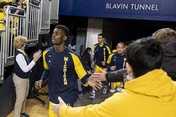 Moussa Diabate (14), Caleb Houstan (22), and DeVante' Jones (12)