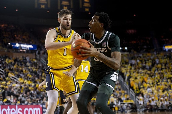 Hunter Dickinson (1) and Moussa Diabate (14)