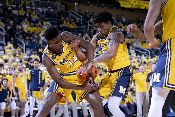 Moussa Diabate (14) and Eli Brooks (55)