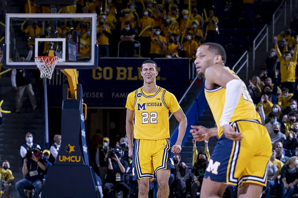 Caleb Houstan (22) and DeVante' Jones (12)