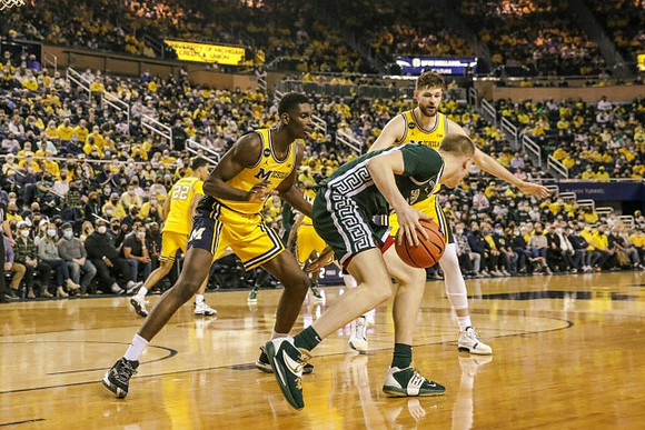 Caleb Houstan (22), Moussa Diabate (14), and Hunter Dickinson (1)