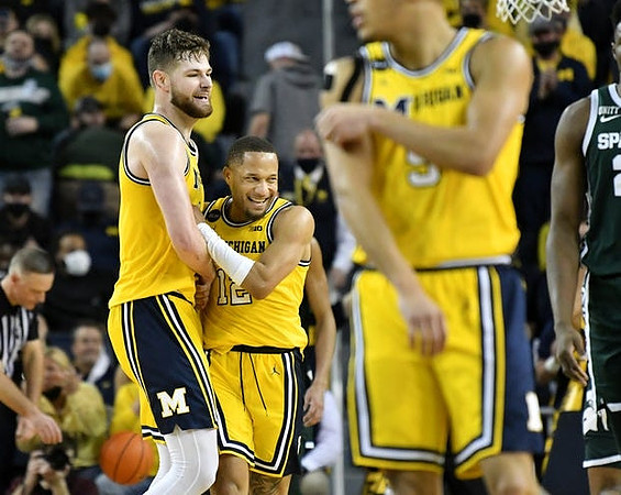Hunter Dickinson (1), DeVante' Jones (12), and Terrance Williams II (5)