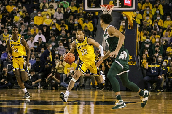 Moussa Diabate (14) and DeVante' Jones (12)