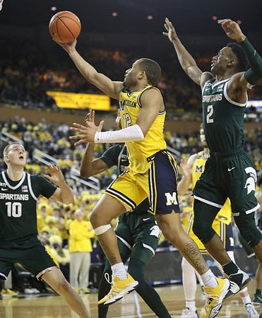 DeVante' Jones (12) and Hunter Dickinson (1)