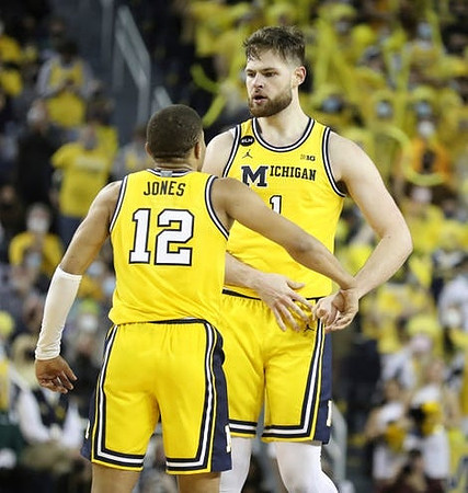 DeVante' Jones (12) and Hunter Dickinson (1)