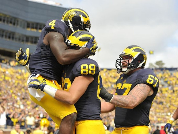 De'Veon Smith (4) , Jake Butt (88), and Kyle Kalis (67)