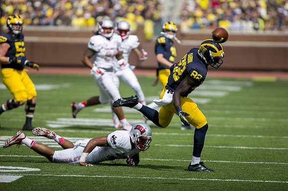 Mason Cole (52), Amara Darboh (82), and Jake Rudock (15)