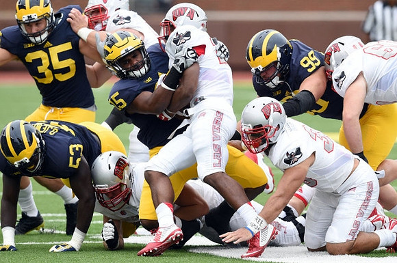 Joe Bolden (35), Mario Ojemudia (53), James Ross (15), and Matthew Godin (99)