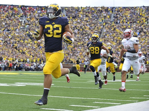 Ty Isaac (32) and Jake Butt (88)