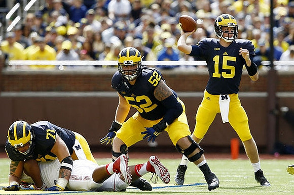 Ben Braden (71), Mason Cole (52), and Jake Rudock (15)
