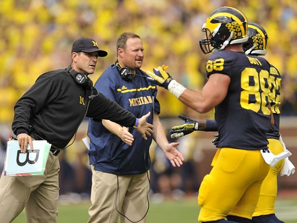 Jim Harbaugh, Tim Drevno, Jake Butt (88), and Amara Darboh (82)