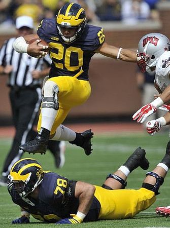 Drake Johnson (20) and Erik Magnuson (78)