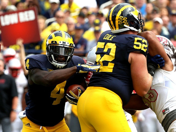 De'Veon Smith (4) and Mason Cole (52)