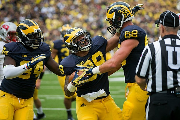 A.J. Williams (84), Sione Houma (39), and Jake Butt (88)