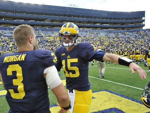 Desmond Morgan (3) and Jake Rudock (15)